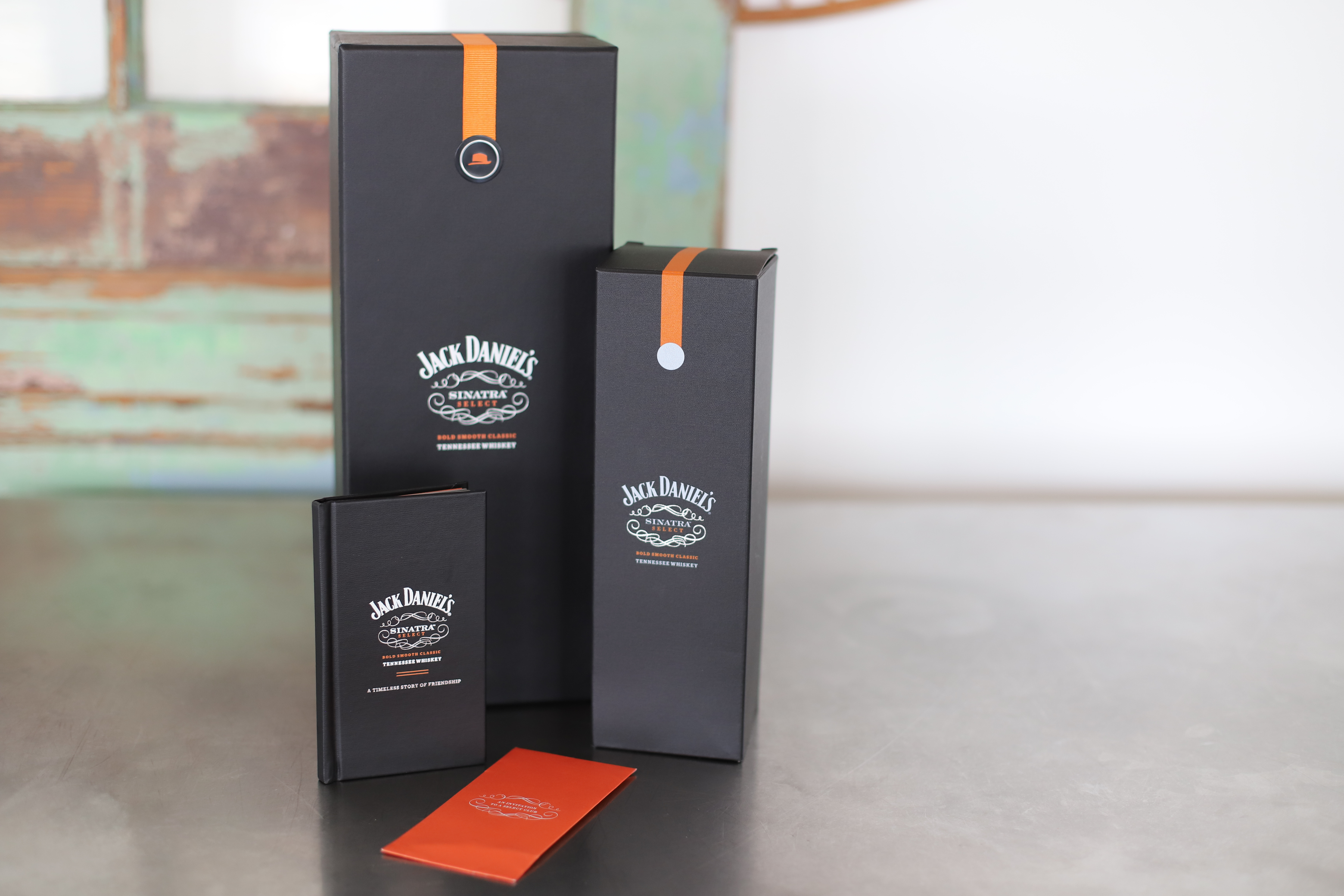 Jack Daniel's book and boxes covered in Arrestox® Black