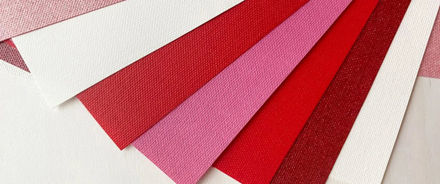Color swatches of red, pink, and white fabric textures on a white background